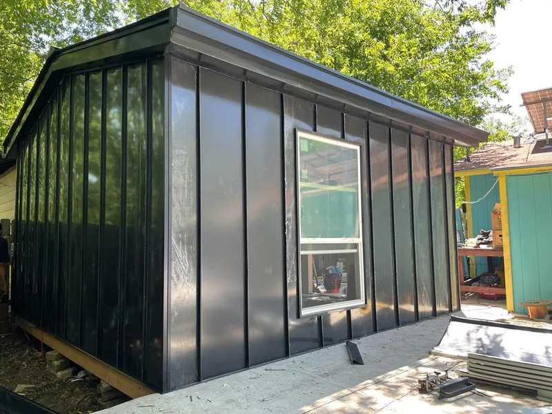 Black standing seam metal wall panels for Roof Inspection in Belle Chasse